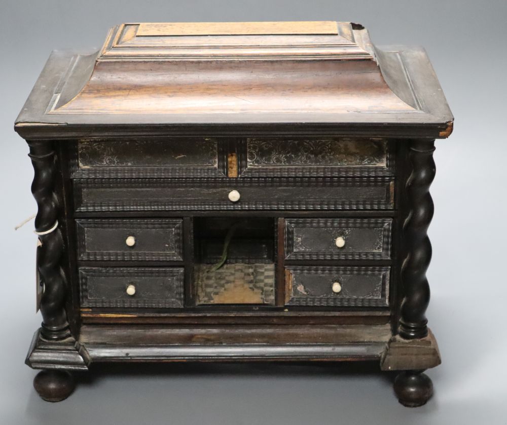 An 18th/19th century Continental ebony veneered table cabinet of drawers (modified)